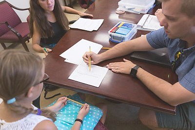 teacher working with student